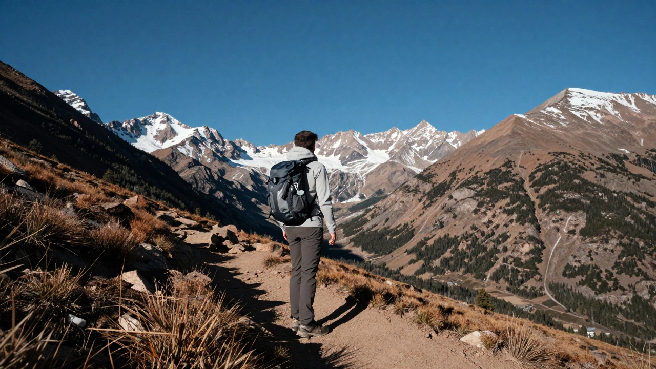 Hiker overlooking the Rocky Mountains in Colorado during a clear morning.